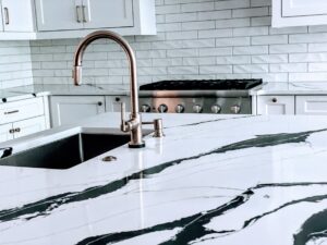 Black and White quartz Kitchen Countertop with Rose Gold Faucet