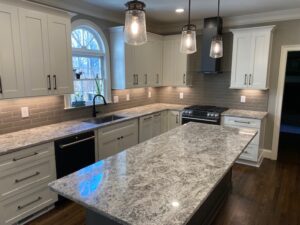 "Classic Kitchen with Gray Cabinets, Granite Counters & Subway Tile "