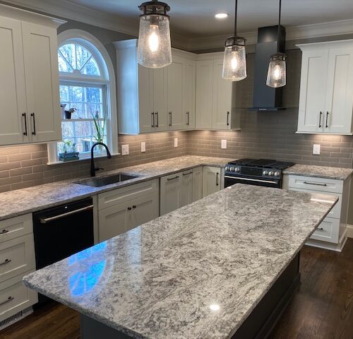 "Classic Kitchen with Gray Cabinets, Granite Counters & Subway Tile "