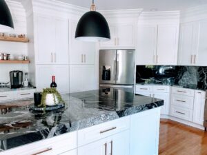 Modern Kitchen with White Cabinets, Black granite & Gold Accents