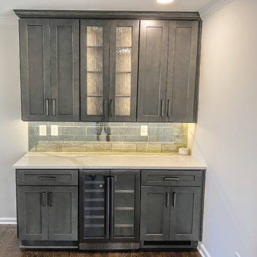 "Modern Home Bar with Dark Cabinets, Frosted Glass & Green Tile Backsplash "