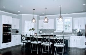 Modern Kitchen with White Cabinets, Gray Island & Quartz Countertops