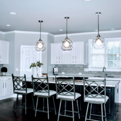 Modern Kitchen with White Cabinets, Gray Island & Quartz Countertops