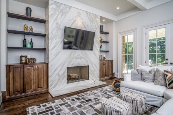 "Modern Living Room with Fireplace, TV, French Doors & White Sofa "